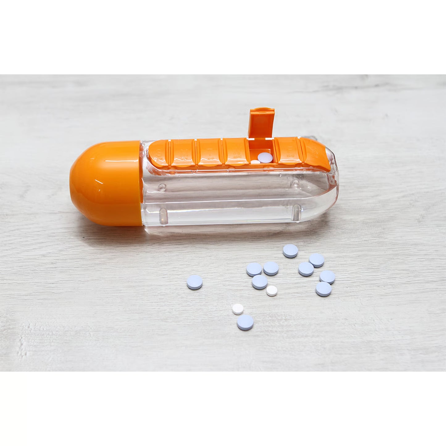 Botella con pastillero